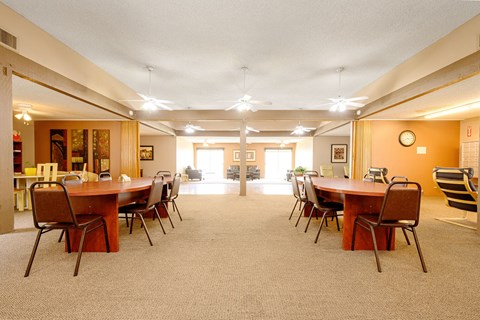 a conference room with a large table and chairs